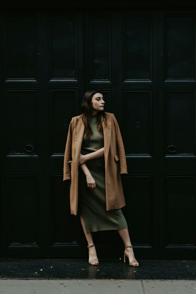 Woman wearing classic beige jacket with neutral toned dress for the daily fashion tips.